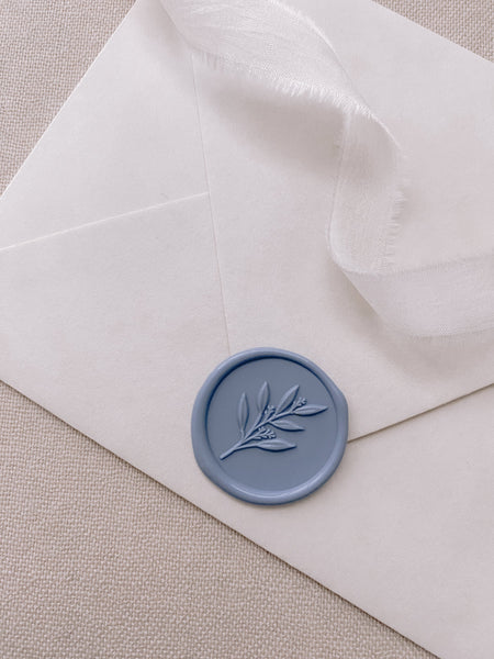 3D leaf branch wax seal sticker in dusty blue on paper envelope