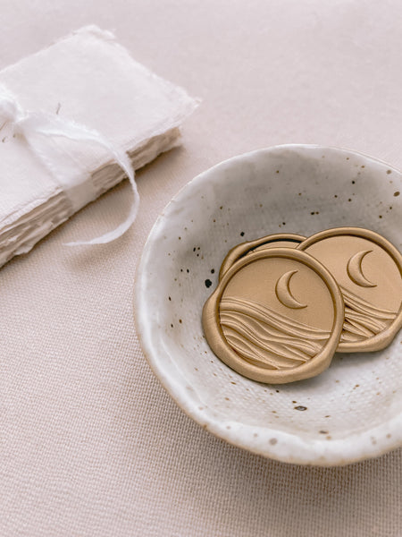 3D moon and ocean wax seals in gold