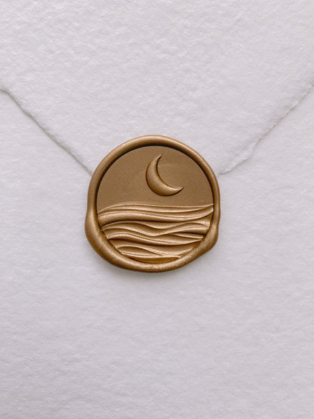 3D moon and ocean wax seal in gold