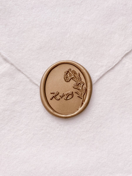 Oval floral monogram wax seal in gold