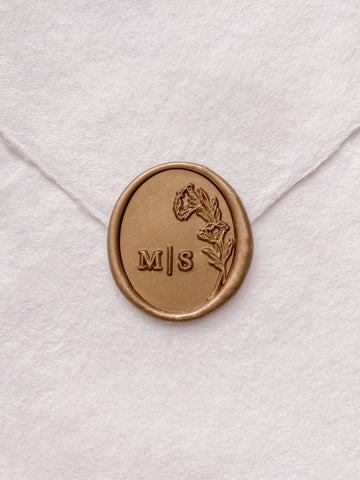 Oval floral monogram wax seal in gold