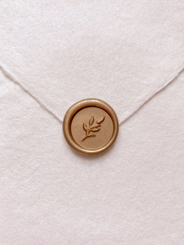 Leaf design mini wax seal in gold on handmade paper envelope