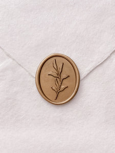 Leaf design oval wax seal in gold on handmade paper envelope