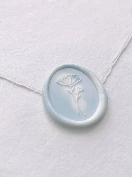 Abstract floral design oval wax seal in blue and white marbled color 