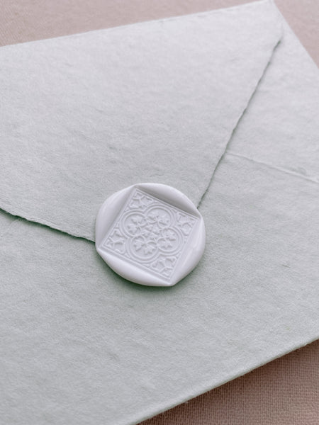 Moroccan tile pattern white wax seal on handmade paper envelope