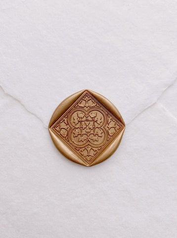 Moroccan tile pattern square shaped wax seal in gold on handmade paper envelope