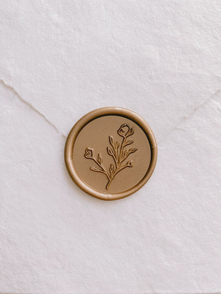 Botanical floral wax seal in gold on handmade paper envelope_front angle
