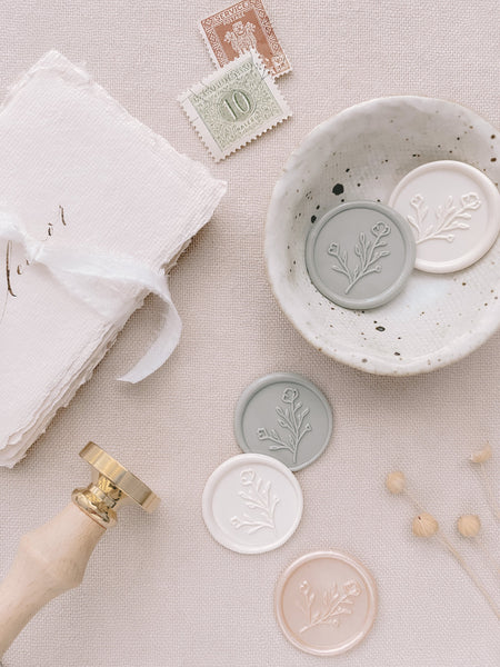 Botanical floral wax seals in white, light gray, and nude pearl