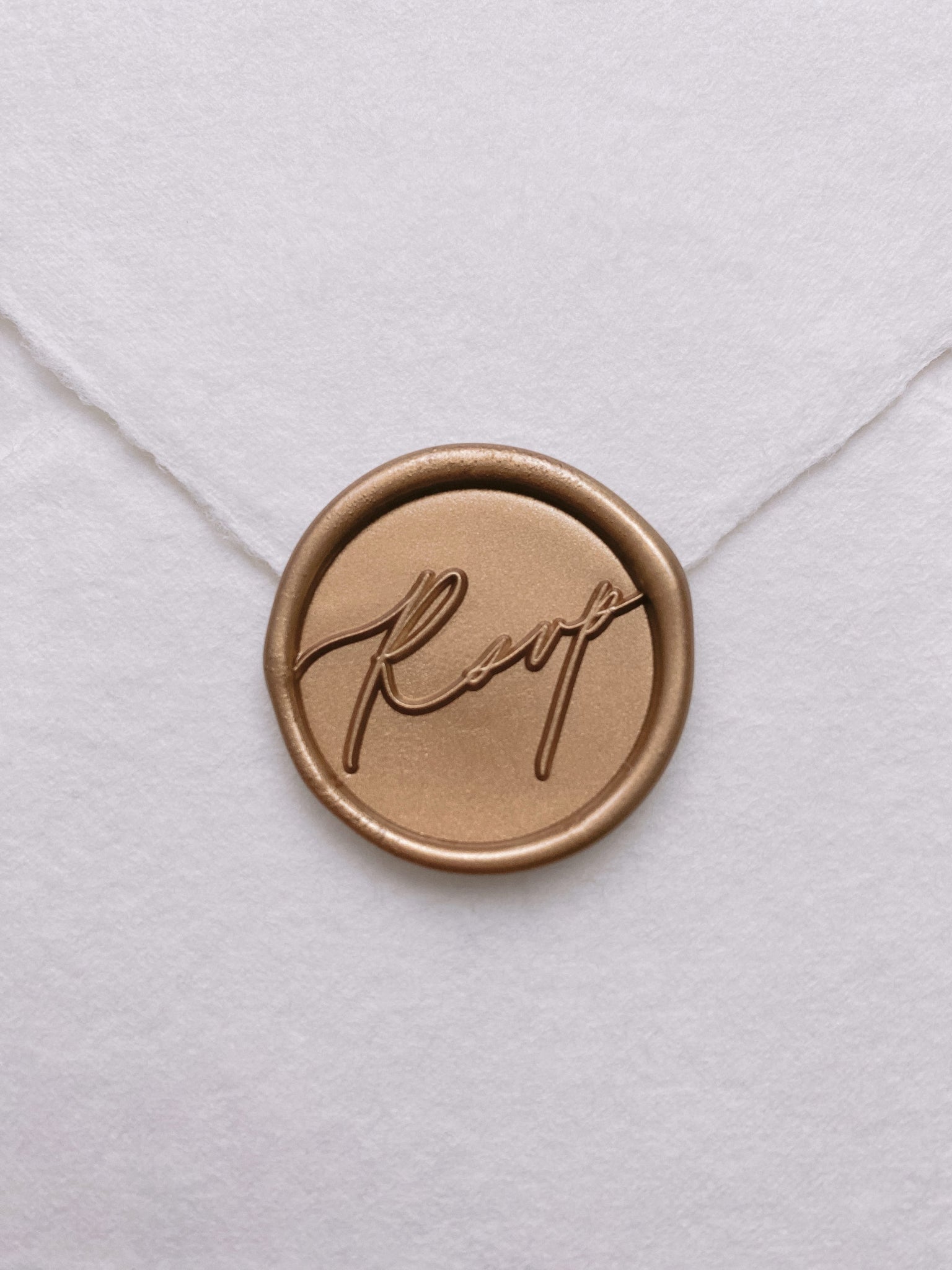 Calligraphy script rsvp wax seal in gold_front angle