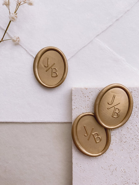 Modern monogram oval wax seals in gold