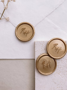 Calligraphy script monogram round wax seals in gold