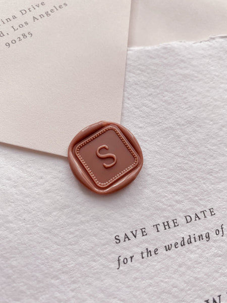 Single initial with border design mini square wax seal in dusty rose