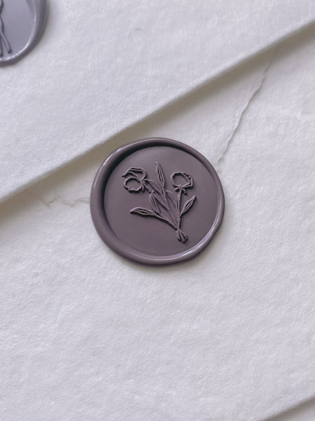 dark purple flower bouquet wax seal on handmade paper envelope_side angle