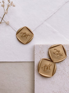 Calligraphy script monogram diamond shaped wax seals in gold