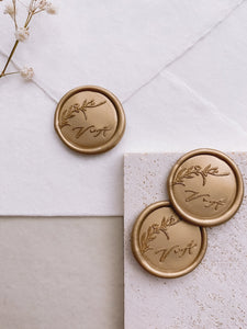 Floral branch round wax seals in gold with personalized calligraphy script monogram