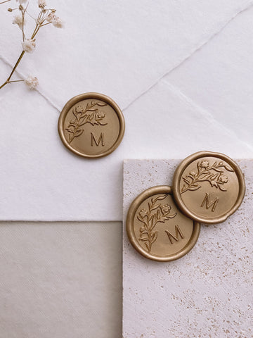Personalized initial floral silhouette round wax seals in gold