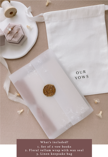 Vow books packaging with floral vellum jacket, gold wax seal and white linen keepsake bag