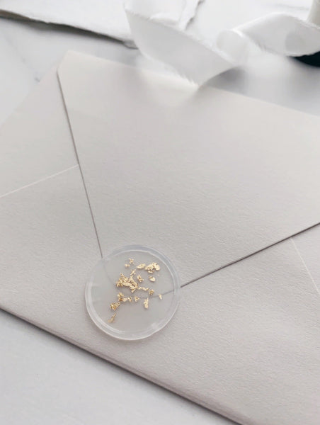a gold leaf vellum wax seal on paper envelope_side angle