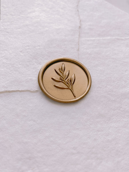 3D leaf branch wax seal in gold on handmade paper envelope_side angle
