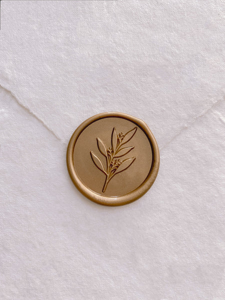 Leaf branch wax seal in gold_front angle