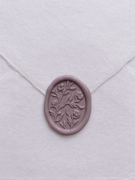 3D engraved floral wax seal in mauve on handmade paper envelope_front angle
