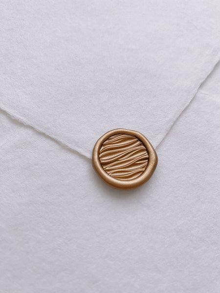 Mini 3D ocean waves wax seal in gold on handmade paper envelope_side angle