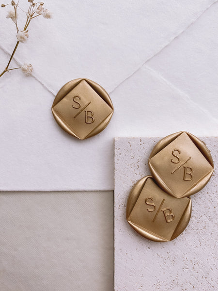 Modern monogram diamond shaped wax seals in gold