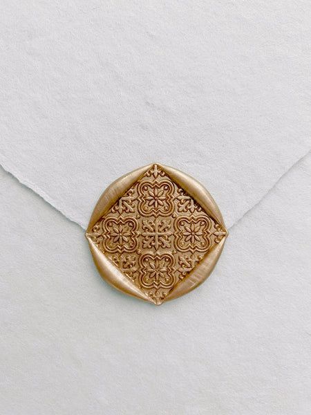 Moroccan tile pattern wax seal in gold on handmade paper envelope