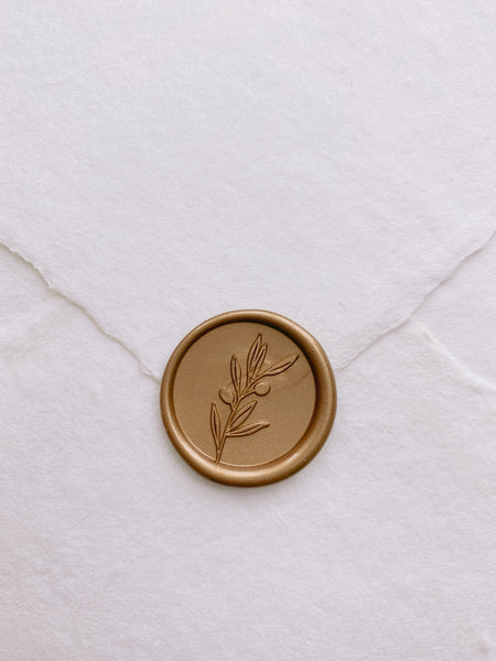 Olive branch wax seal sticker in gold on handmade paper envelope