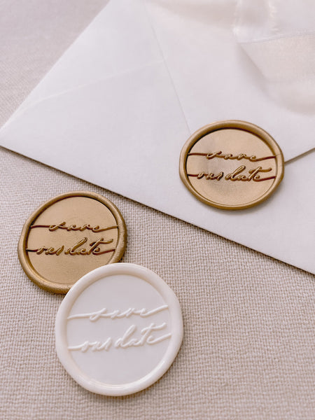 Calligraphy script Save Our Date wax seals in gold and antique white