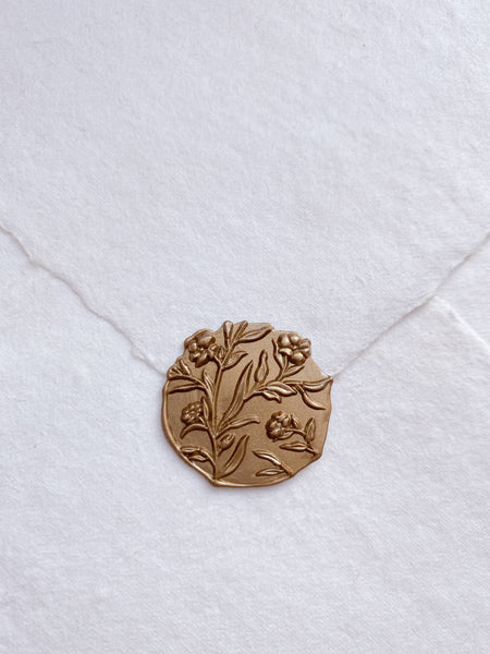 3D floral edgeless wax seal in gold on handmade paper envelope