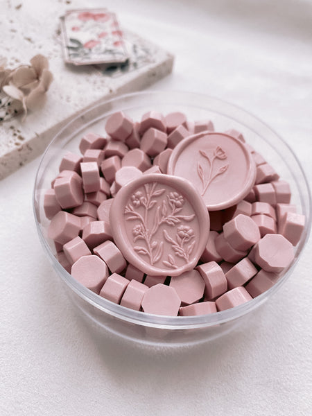 a box of mauve blush color sealing wax beads with scarlette 3d floral wax seal and simple flower wax seal in mauve blush color