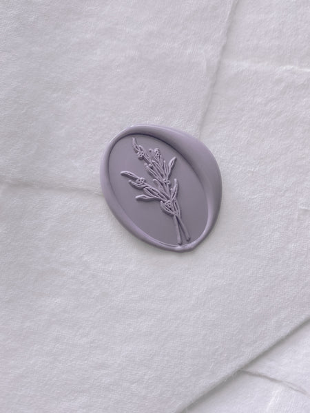 lavender colored oval flower bouquet wax seal on handmade paper envelope_side angle