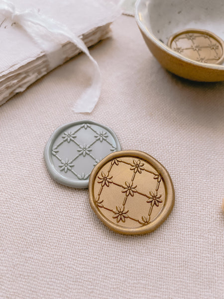 Daisy flower pattern wax seals in gold and sage green