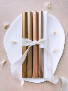 a set of 5 metallic earthy tones sealing wax sticks in classic gold, golden dune, peachy gold, mocha, white pearl colors_front angle