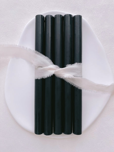 a set of 5 black color sealing wax sticks