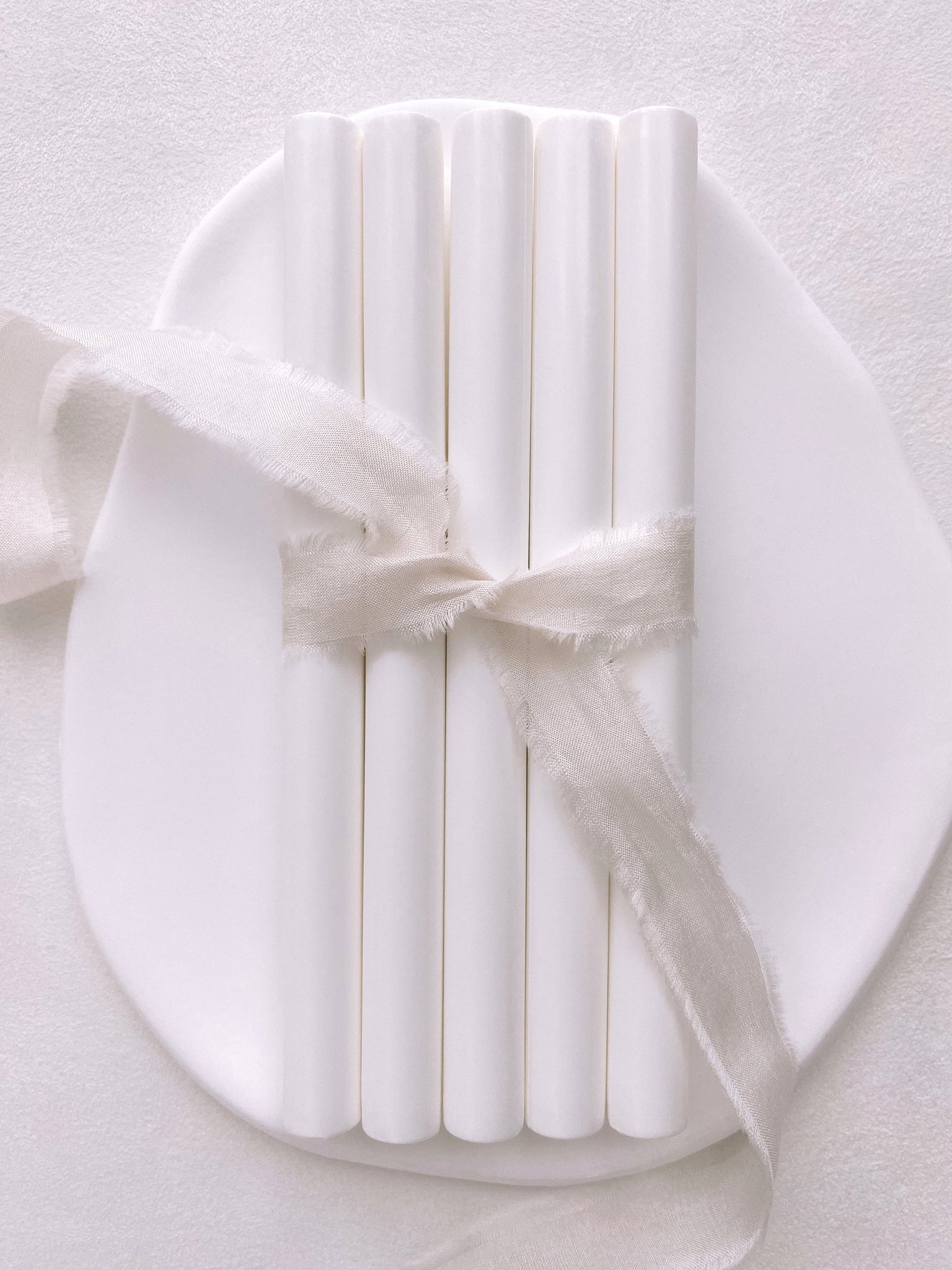 a set of 5 soft white sealing wax sticks