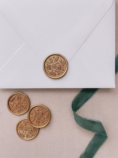 Winter Garden gold wax seals on white envelope